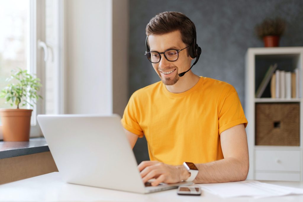 Happy programmer holding video call with colleagues clients partners